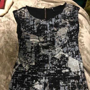 Size S Black tunic top with grey and silver foil.